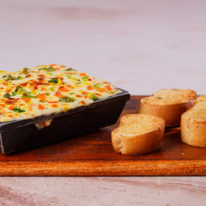 "A delicious serving of lasagna with layers of rich pasta, creamy béchamel, savory meat sauce, and melted cheese, perfectly baked to golden perfection."
