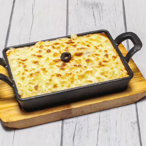 "A delicious serving of lasagna with layers of rich pasta, creamy béchamel, savory meat sauce, and melted cheese, perfectly baked to golden perfection."