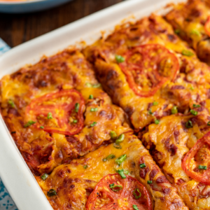 "A delicious serving of lasagna with layers of rich pasta, creamy béchamel, savory meat sauce, and melted cheese, perfectly baked to golden perfection."