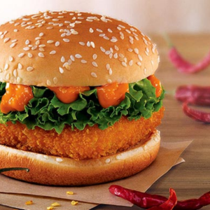 "A juicy burger with a perfectly cooked patty, fresh lettuce, tomato, cheese, and pickles, all sandwiched between a soft, toasted bun."