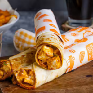 "Delicious Frankie wrap filled with spiced vegetables, grilled meat, and fresh toppings, all wrapped in a soft, warm flatbread."