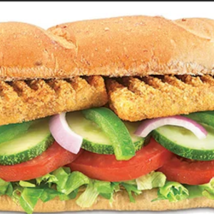 "A delicious sandwich filled with layers of fresh vegetables, meat, and cheese, all nestled between two slices of perfectly toasted bread."