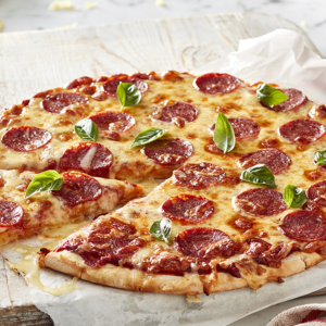 "Close-up of a freshly baked pizza with melted cheese, colorful vegetables, and savory toppings on a golden, crispy crust."